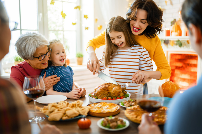 Patient with dental implants eating with family